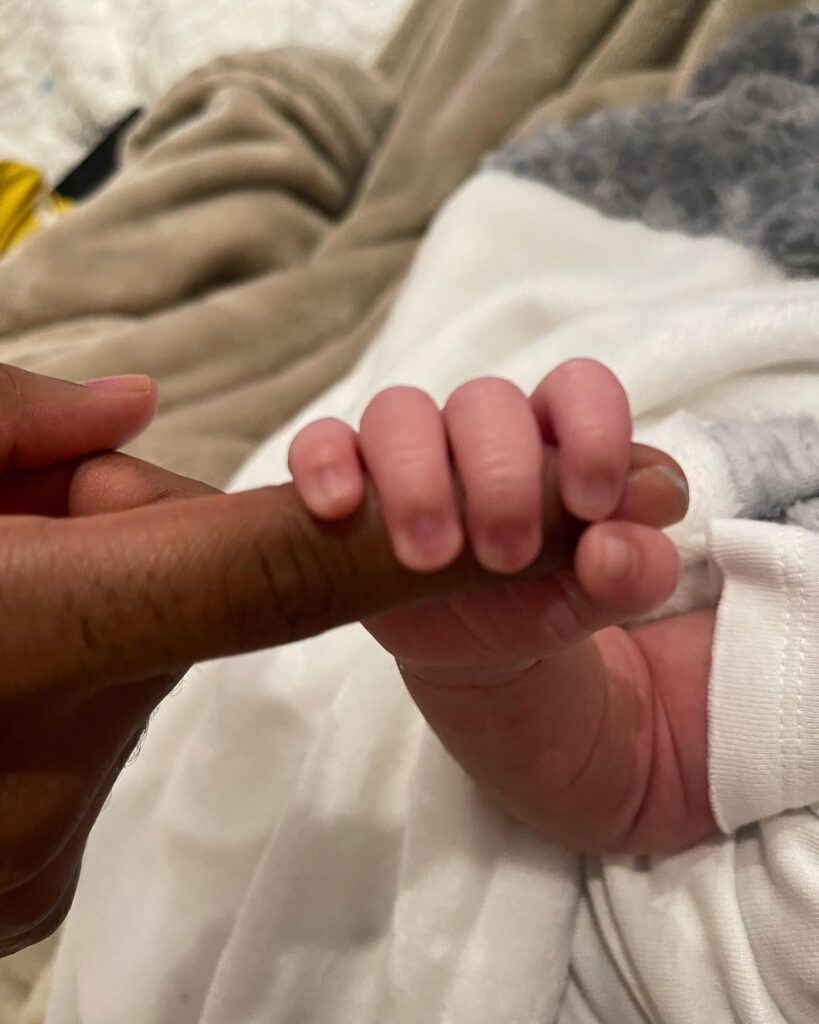 Big sean and Jhené baby boy holding hand